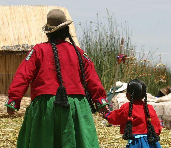 A mother and daughter on the Uros floating islands&nbsp;of Lake Titicaca in&nbsp;Peru
Photo by Dag Peak/flickr