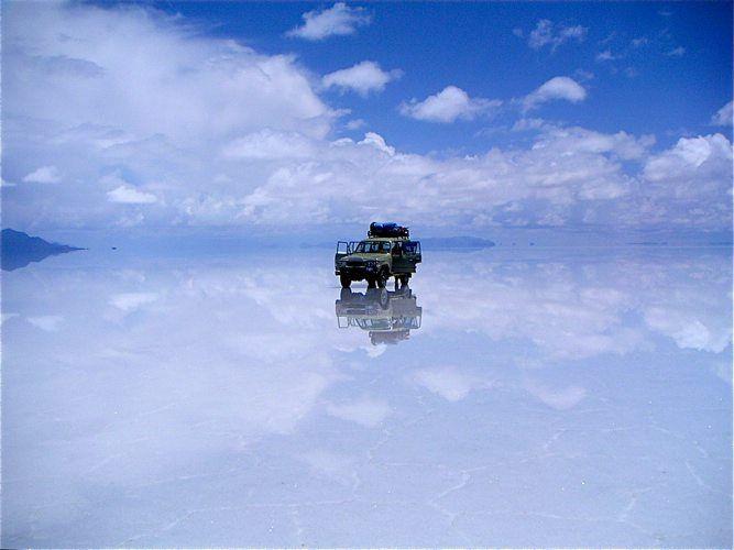 Some people opt to drive to the open planes of Bolivia's Uyuni Salt Flats. Photo by BoomsBeat