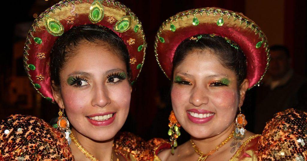 Women in traditional costumes at the Candelaria Festival in Puno. Image by Monica Volpin from Pixabay.