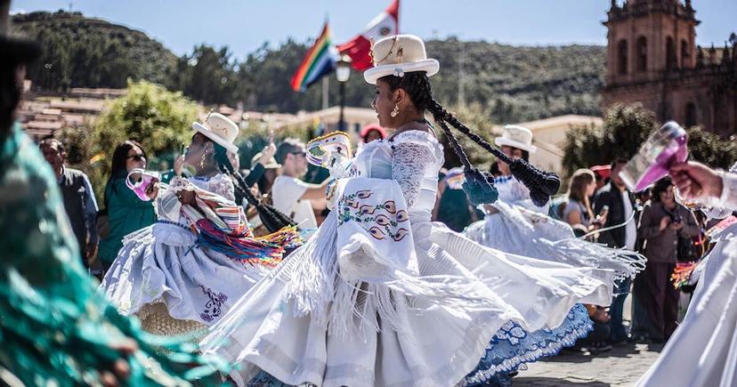 Quechua woman dancing. Photo by Peru for Less.