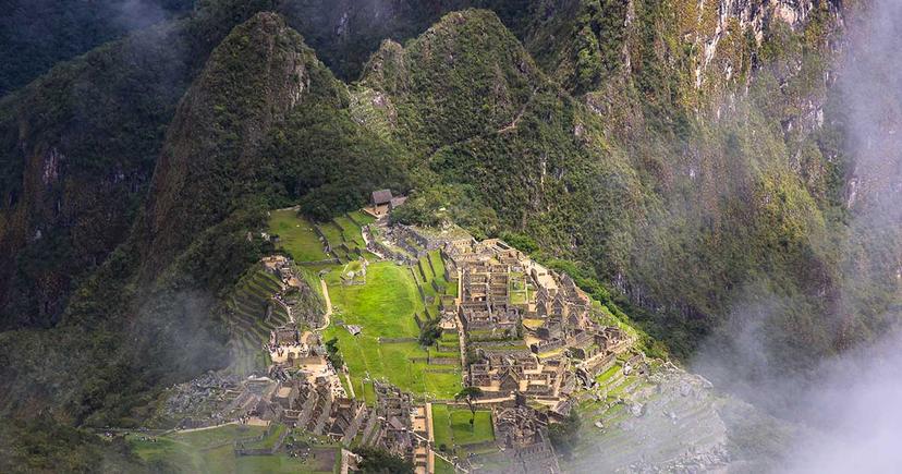 <div class="entry-thumb-caption">Mist frames the Machu Picchu ruins seen from the Machu Picchu Mountain hike. Photo by <a href="http://www.daniellabeccaria.com/" rel="noopener noreferrer" onclick="javascript:window.open('http://www.daniellabeccaria.com/'); return false;">Daniella Beccaria</a>.</div>