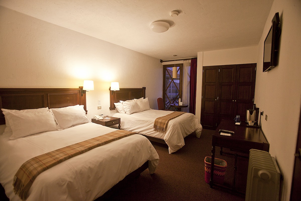 Two bed in a double room at the Casa Andina Premium Puno.