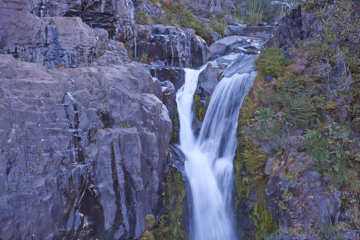 A waterfall pours over granite rocks near Chillan, Chile.