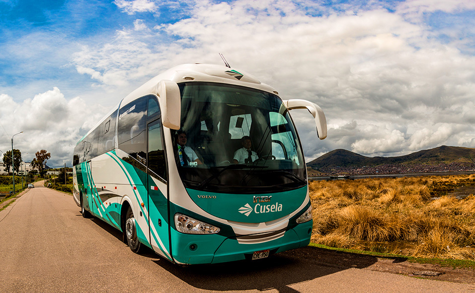 A Cusela bus on the road.