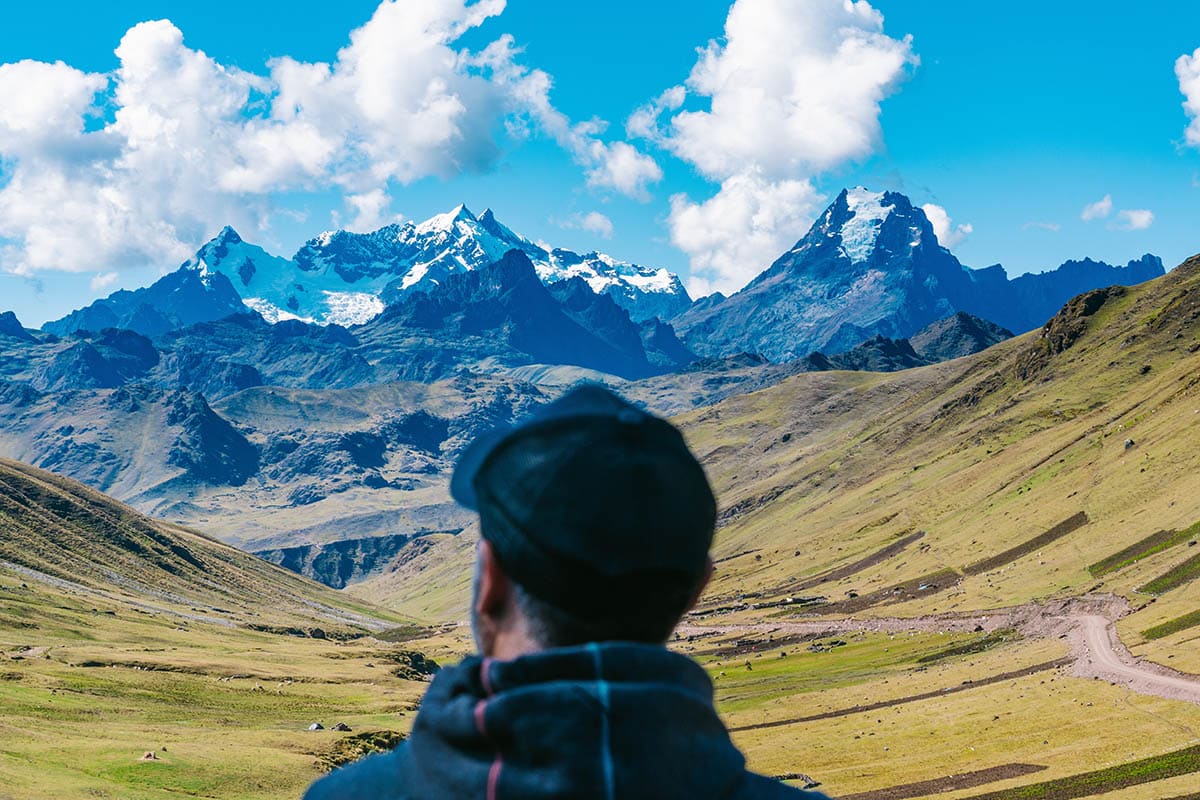 A man looking out at a valley in the Andes