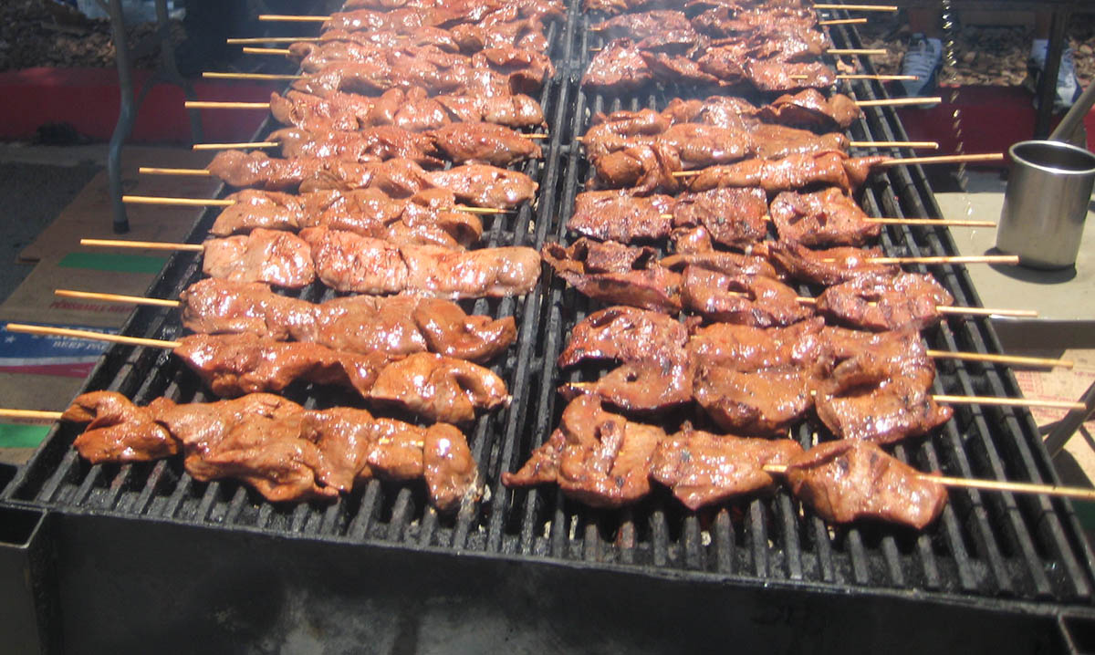 Anticuchos on a grill are a delicious Peruvian street food.