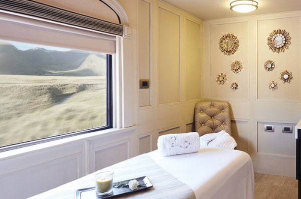 Massage car with Andean Scenery out the Window on Belmond Andean Explorer train in Peru.