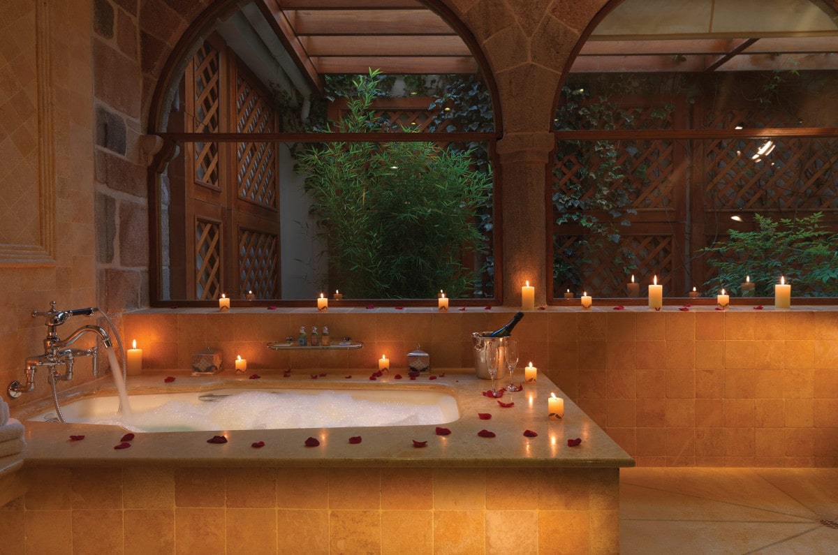 Andean bath with rose petals and candles at Hotel Monasterio in Cusco.