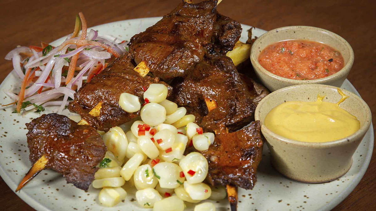 A plate of anticuchos, skewered beef hearts, at Chicha, a top restaurant in Cusco.