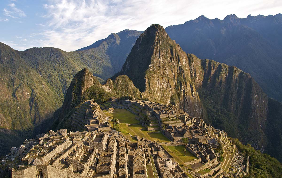 The classic "postcard" shot of Machu Picchu taken in golden light from the Guardian House.