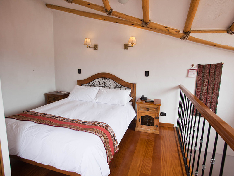 Comfy and traditional double room at Casa San Blas Boutique Hotel.