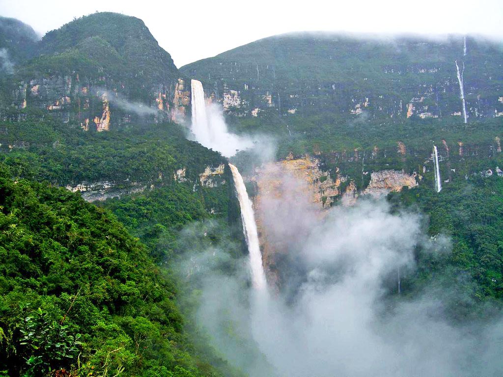 A waterfall with lots of fog at the bottom in the Amazon Rainforest.