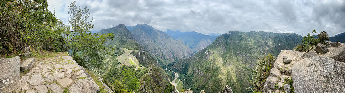 A panoramic view from the Huayna Picchu summit of the mountains and ruins below.
