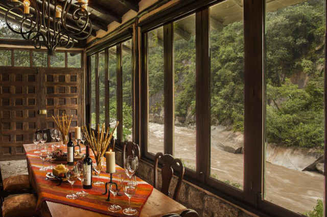 Dining room and wine cellar combo overlooking the river at Inkaterra el Pueblo