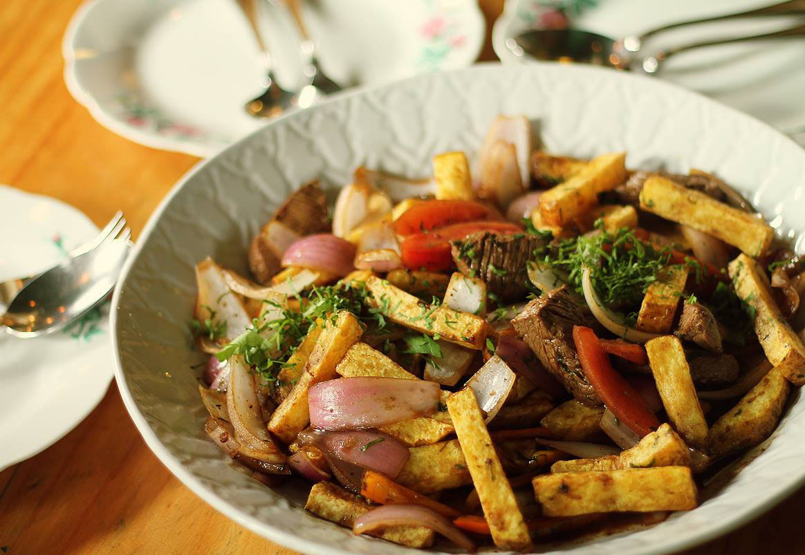 A plate with beef and vegetable stir fry at Isolina, one of the best restaurants in Lima.