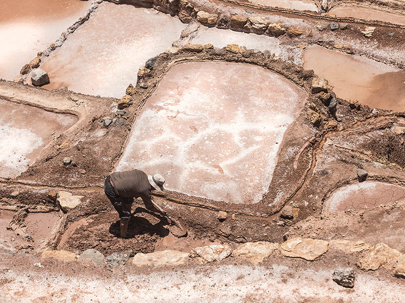 Salt being mined at the Maras Salt Mines near Cusco, Peru.