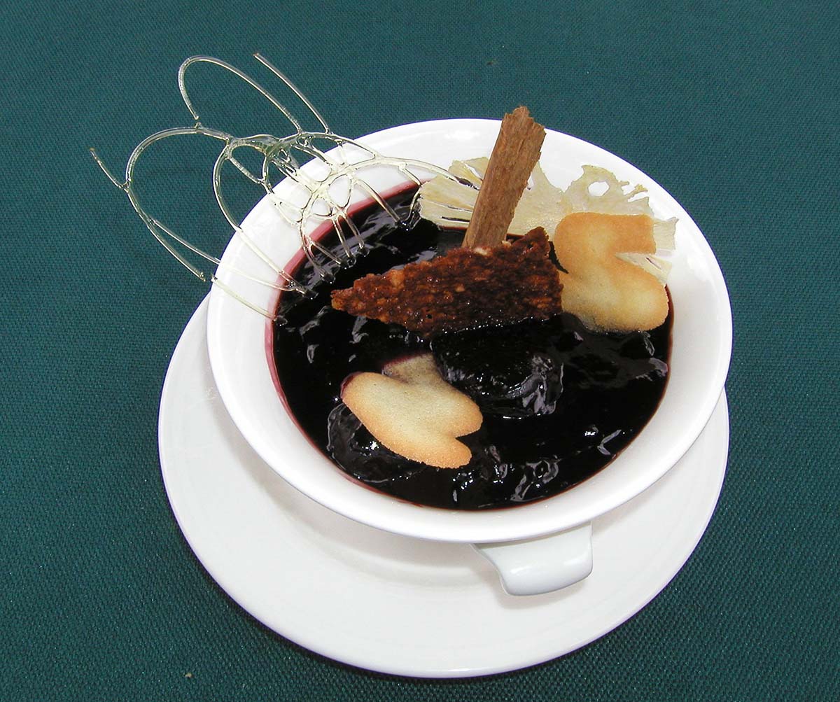 Mazamorra morada, a purple fruit jelly served warm with cinnamon and other spices.
