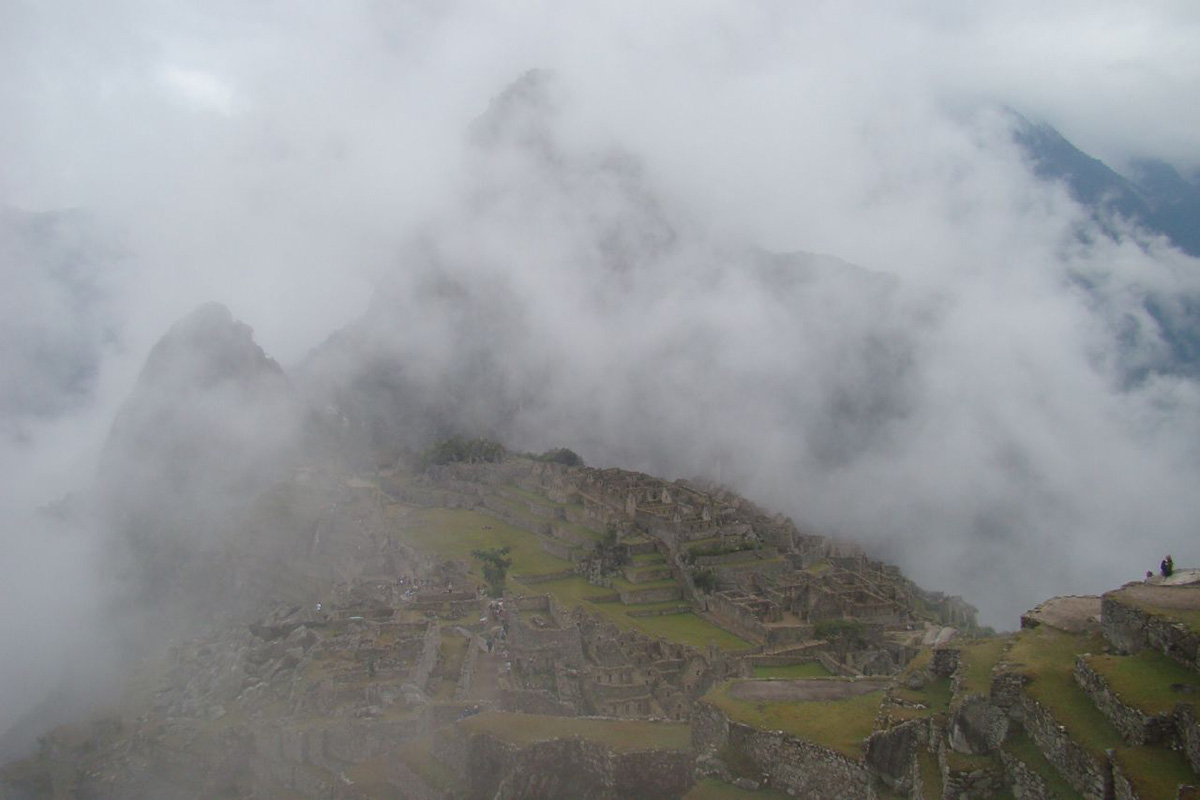 Mist obscures most of the ruins of Machu Picchu during the rainy season.