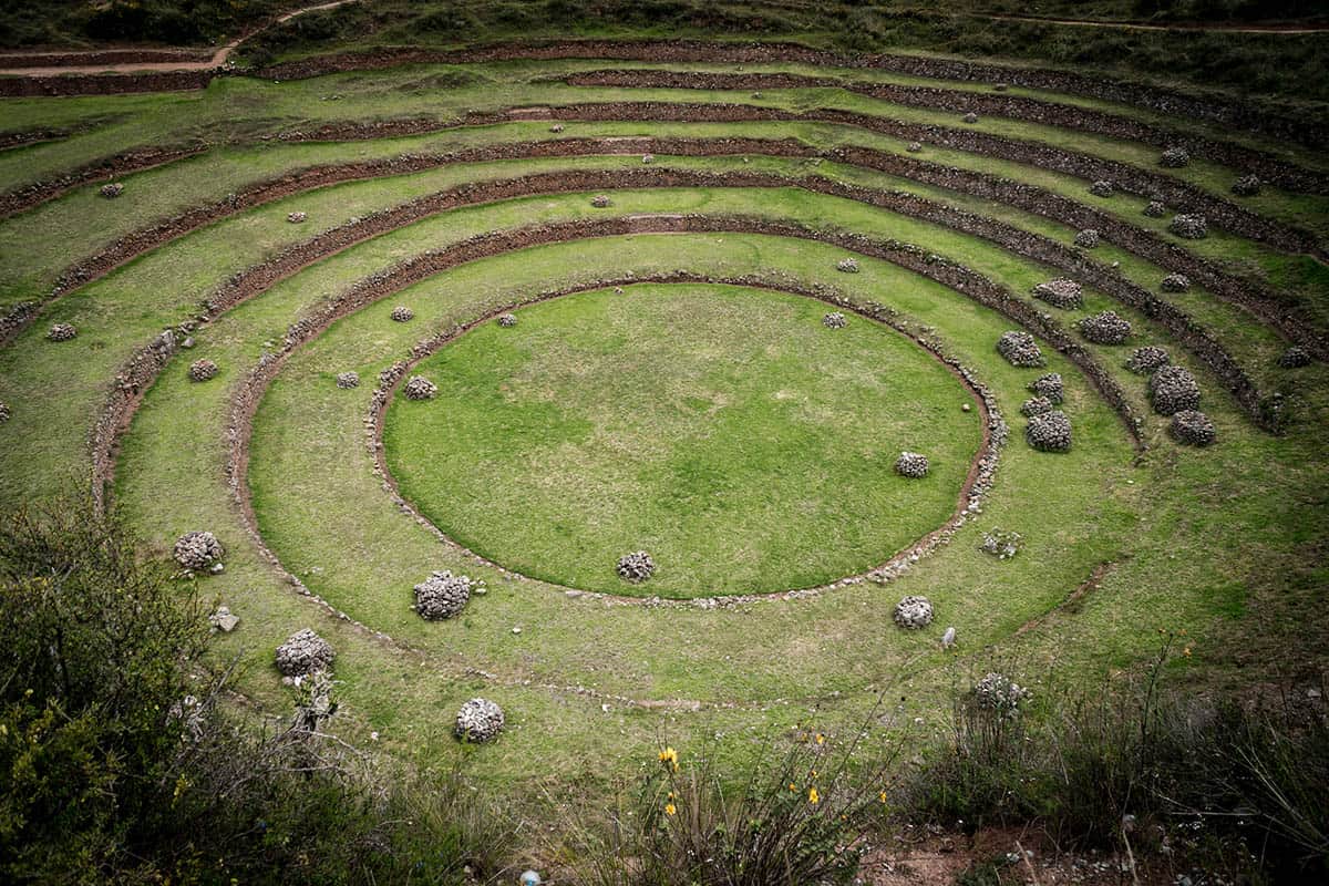 Close up of the circular green grass terraces of Moray, Peru