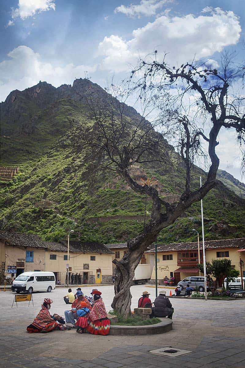Local people sitting in a plaza in Ollantaytambo.
