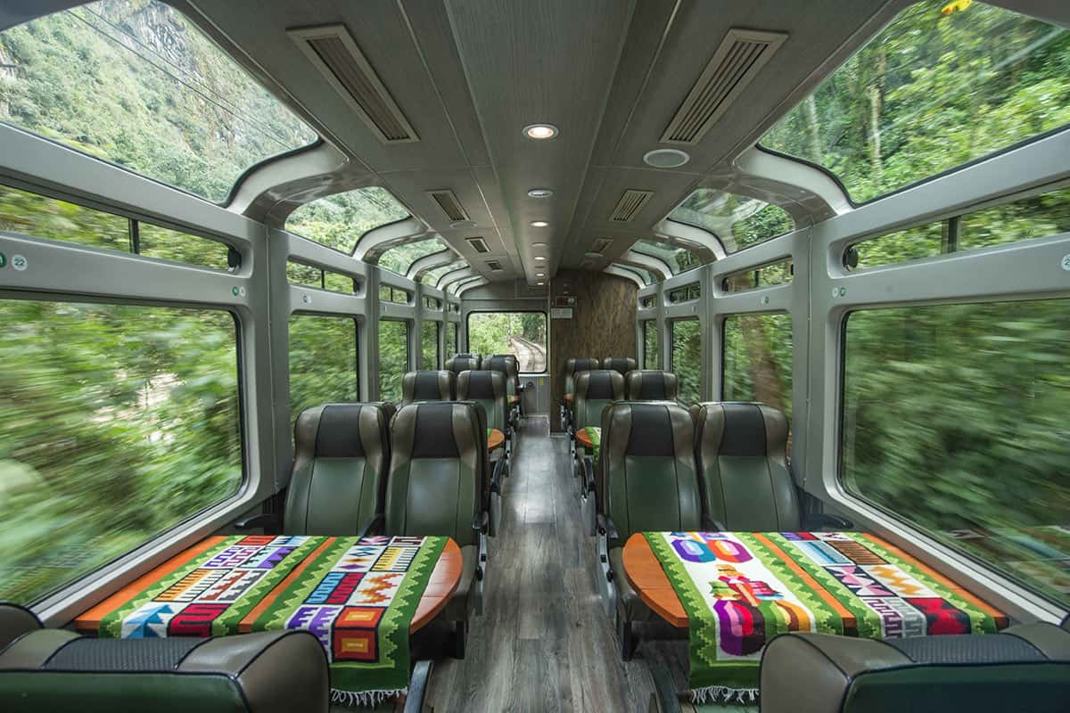 Comfortable rows of seating and large panoramic windows inside the PeruRail Vistadome Train to Machu Picchu.