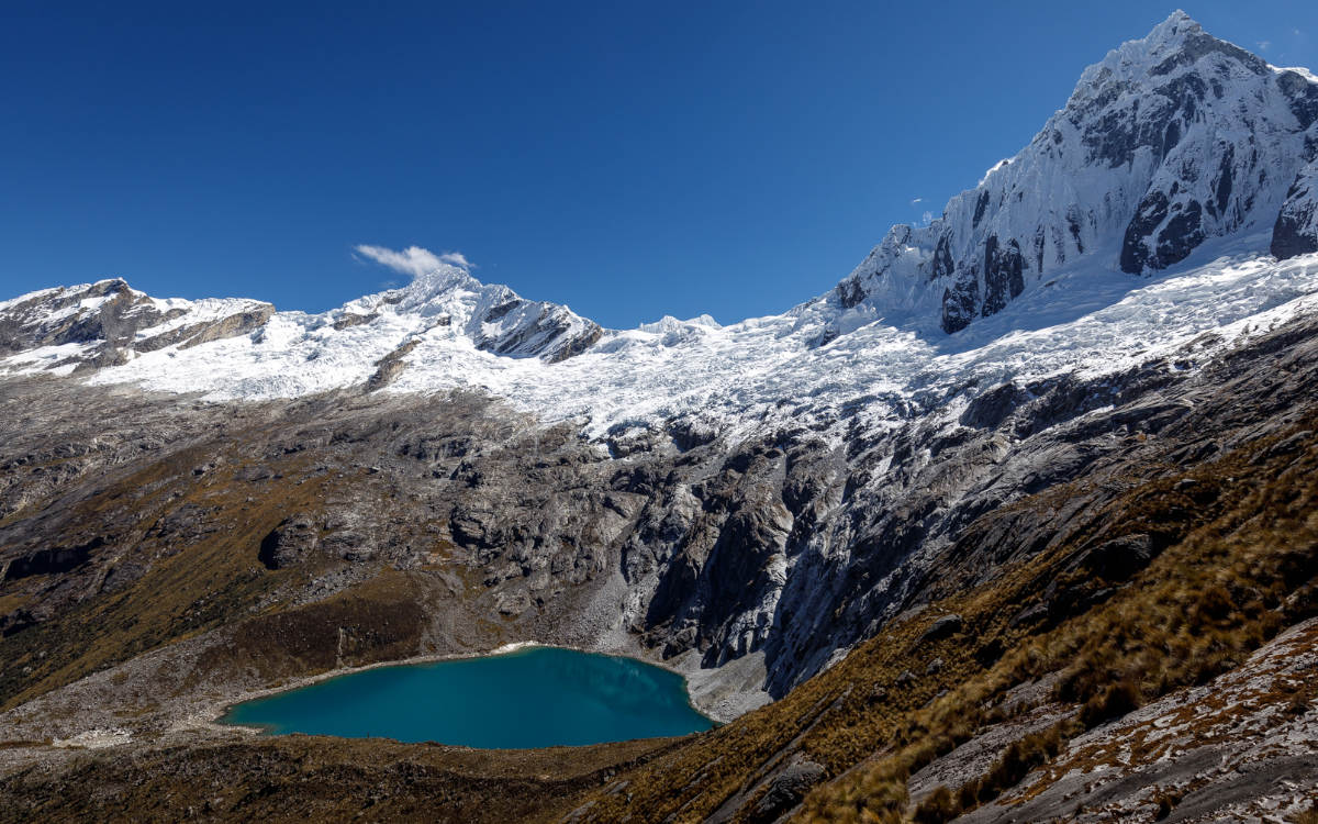 Punta Union Pass with snow and lake along the Santa Cruz Trek in the Cordillera Blanca of Peru.
