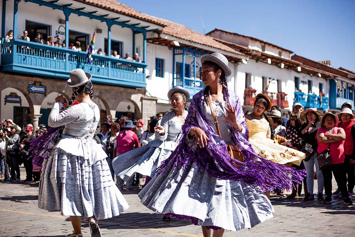 Quechua women dancing in the main plaza of Cusco.