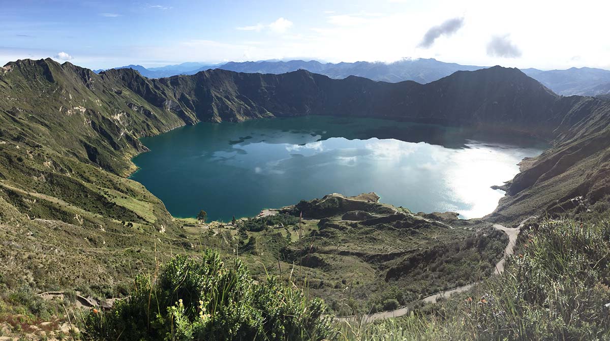 A blue lagoon in a crater, Lake Quilotoa is the starting or ending point for the Quilotoa loop trek.