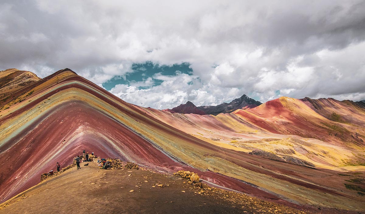 Bright colors of Rainbow Mountain on a cloudy day.