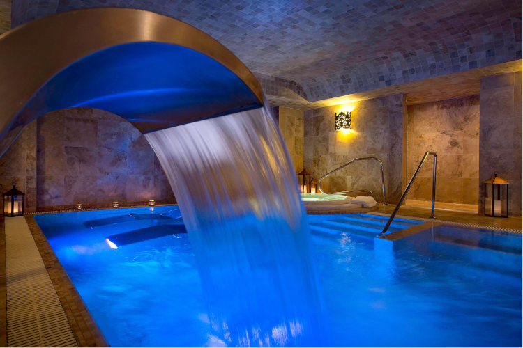 Perspective from behind the indoor waterfall of the hydrotherapy pool