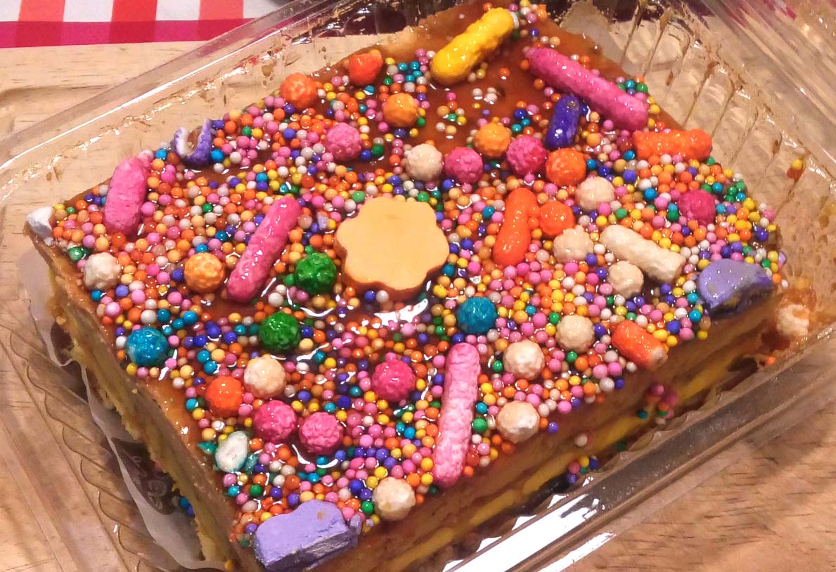 Turron, a famous Peruvian dish, is covered with honey and colorful sprinkles and candy.