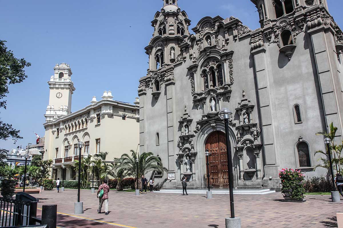 The gray stone facade of the Catholic church in Parque Kennedy.
